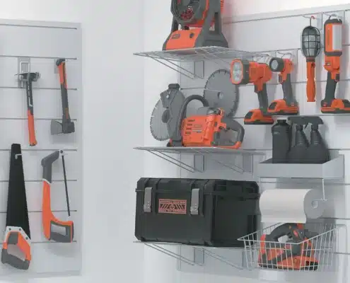 A number of garage storage devices holding tools.