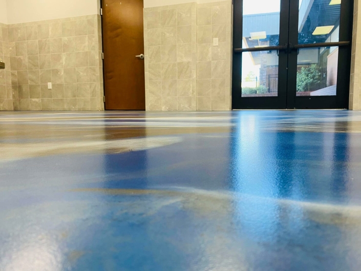 Athletic facility with concrete coated floor.