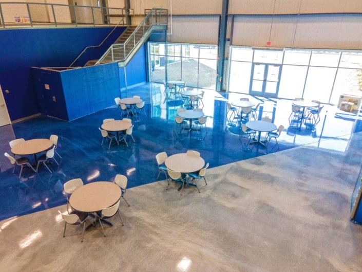 Athletic facility with concrete coated floor.