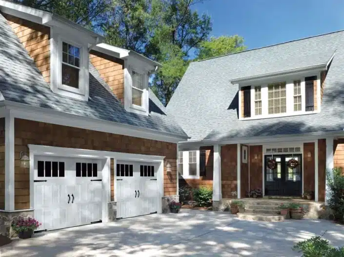 A nice home with a 2 car garage and custom double garage doors.