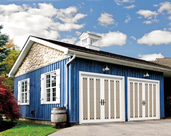 A nice home with a 2 car garage and custom double garage doors.