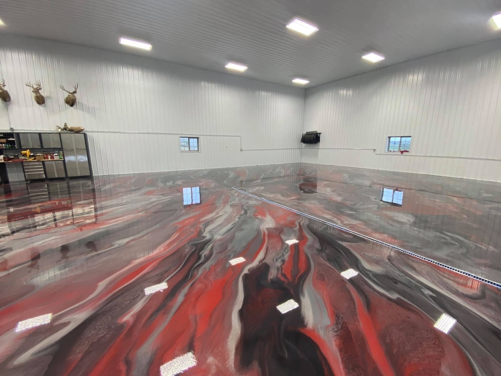 metallic-gallery-2 High gloss red and black swirl concrete coating on floor of industrial building.